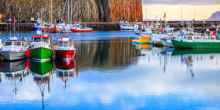The colorful boats in peaceful Stykkisholmur's harbor in western Iceland