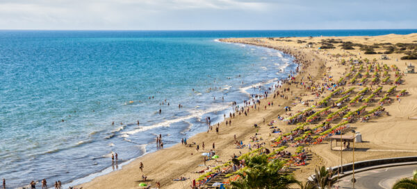 English beach on the island of Gran Canaria in Maspalomas dunes beside